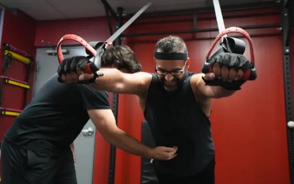 Performance Institute Coach Explaining the Exercise